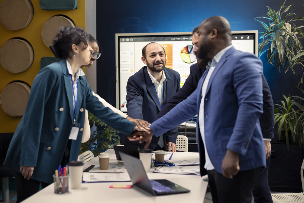 Sales professionals hired for marketing jobs collaborating.
